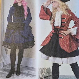 May include: Simplicity pattern 8285 features two costume designs. One is a dark blue dress with a black lace overlay and a matching hat. The other is a red and gold patterned jacket with a black skirt and a pirate hat.