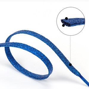 May include: Blue sparkly shoelaces with a close-up of the textured fabric.