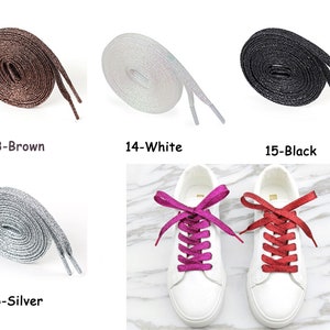 May include: Assortment of sparkly shoelaces in brown, white, black, silver, pink, and red. The shoelaces are shown in a flat lay and on a pair of white sneakers.