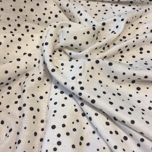 White with black spot print viscose jersey fabric - per metre