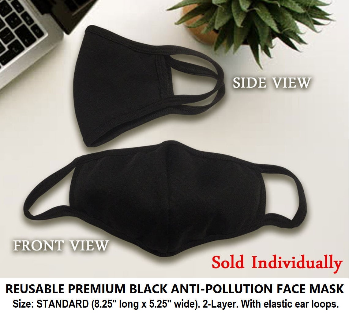 Premium Photo  Expressionless white masks on a black cloth