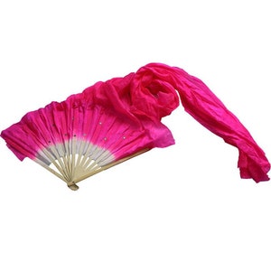 May include: A pink silk fan with a wooden handle and white and pink silk streamers. The fan has a white center with pink edges and is decorated with small silver sequins.