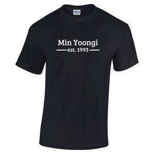 May include: Black t-shirt with white text that reads "Min Yoongi - est. 1993".