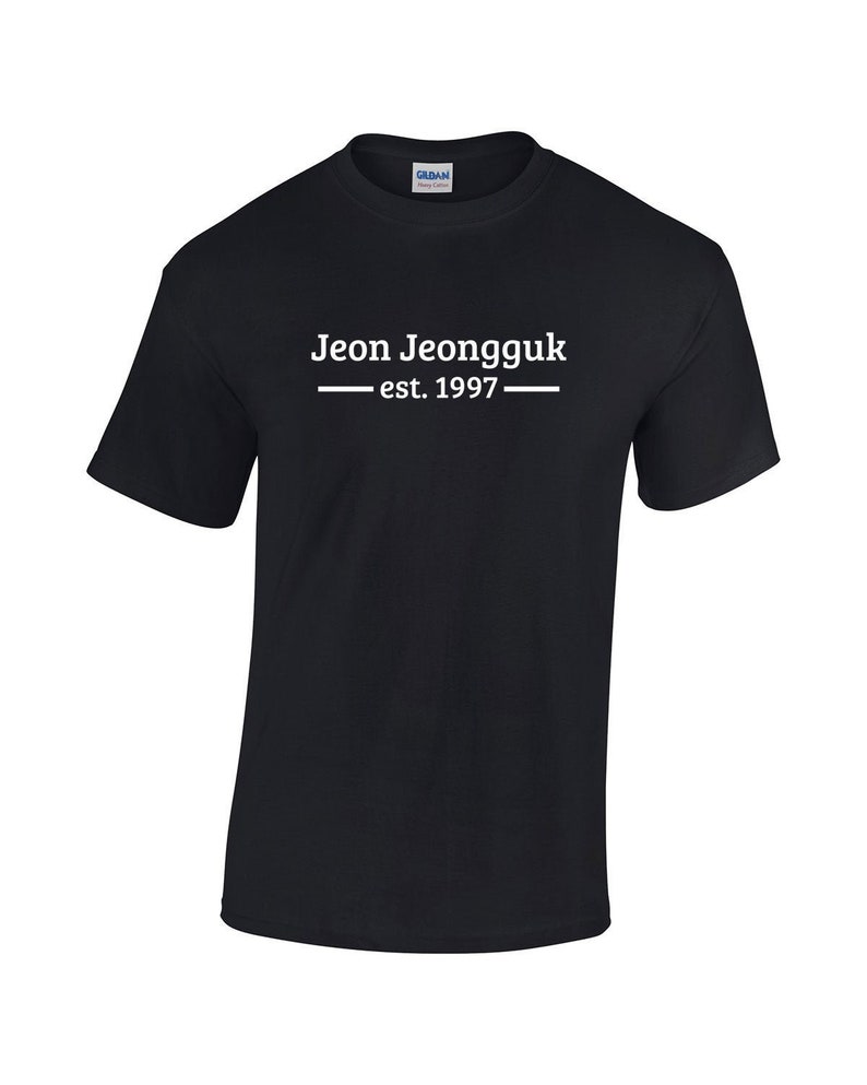 May include: Black t-shirt with white text that reads "Jeon Jeongguk - est. 1997 -"
