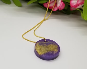 Purple and Gold Round Resin Pendant on a Gold Plated Snake Chain