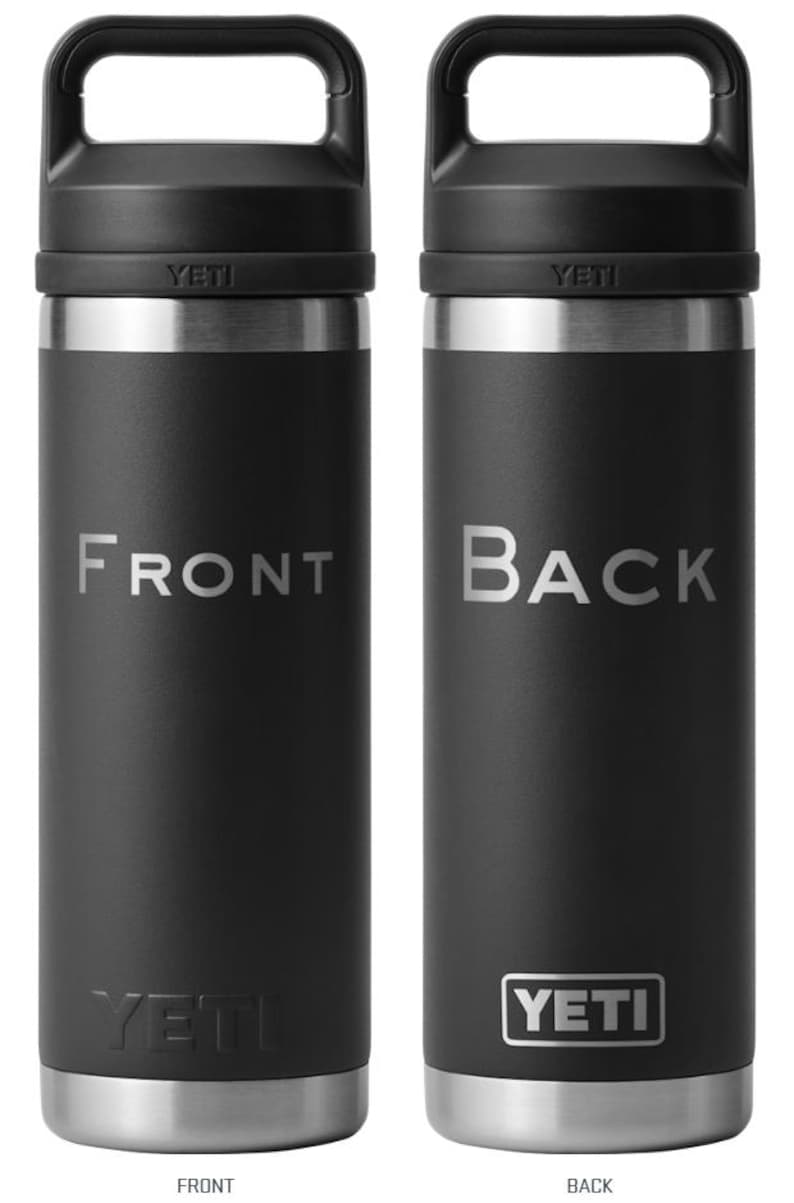 May include: A black YETI Rambler 12 oz. stainless steel insulated can cooler with a carrying handle. The front of the cooler has the word "FRONT" printed in white. The back of the cooler has the word "BACK" printed in white and the YETI logo printed in white.