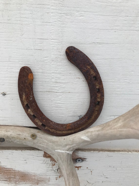 Naturally rusted western horseshoe | Etsy Horseshoe pillow | Etsy