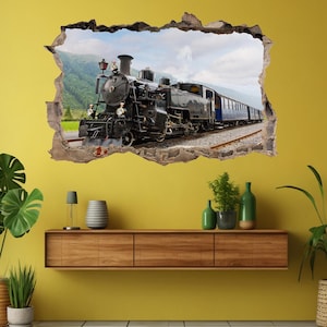 May include: A black and blue steam train engine with smoke coming from the chimney, traveling through a mountain pass. The train is depicted as if it is breaking through a wall, creating a 3D effect.