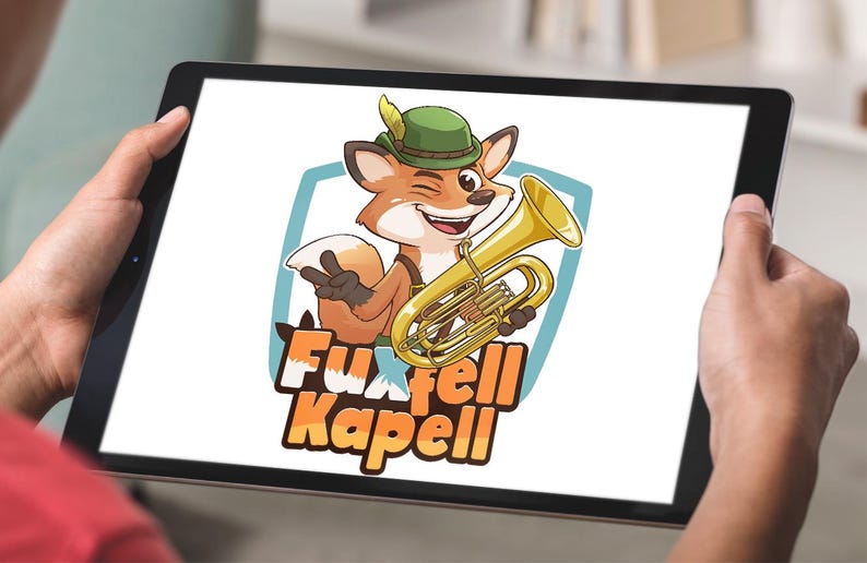 cartoon fox mascot playing a brass tuba, winking and smiling, with the text “Fuxfell Kapell” , custom logo design by Beehaya Studio.