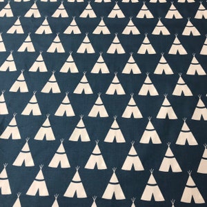 White teepees on navy blue cotton fabric. Sold by th be half yard.