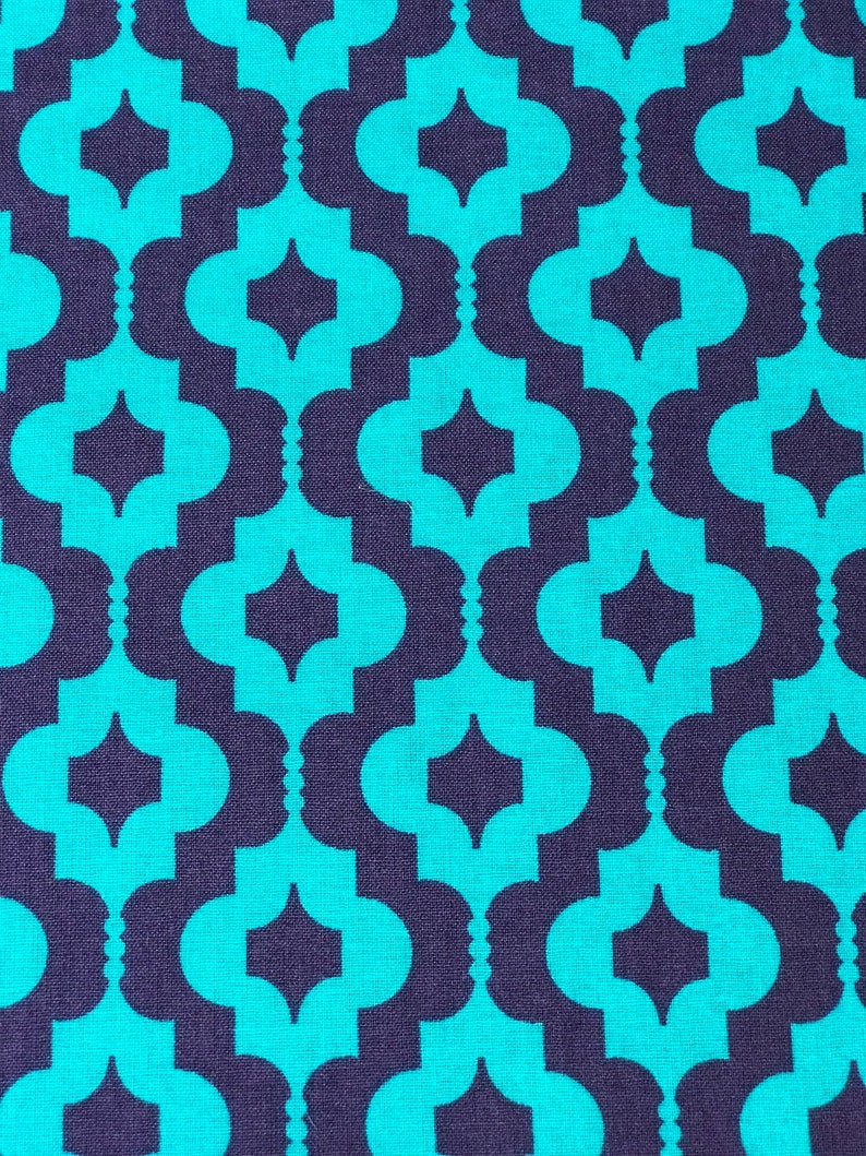 May include: Teal and purple geometric fabric with a repeating pattern of interlocking ovals and diamonds.