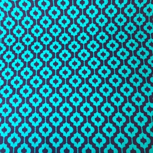 May include: Teal and dark blue geometric fabric with a repeating pattern of interlocking quatrefoils.
