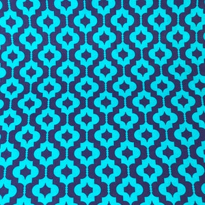 May include: A seamless pattern fabric with a repeating geometric design. The pattern features teal blue and dark purple interlocking shapes.