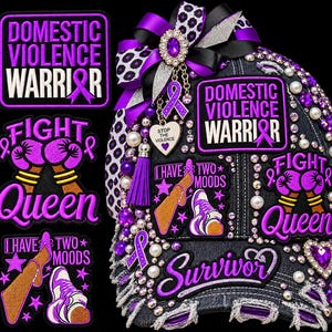 May include: A distressed black denim baseball cap adorned with purple and white patches reading Domestic Violence Warrior, Fight Queen, and I Have Two Moods. The cap features rhinestones, pearls, a purple ribbon charm, and a large purple bow.
