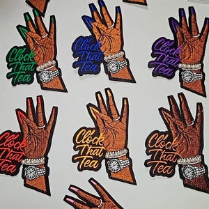 May include: Embroidered patches featuring a brown hand with long, colorful nails, a wristwatch, and a ring. The text "Clock That Tea" is included in a variety of colors. The word "Friday" is written in cursive.