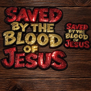 May include: Two embroidered patches featuring the text SAVED BY THE BLOOD OF JESUS. The words SAVED and JESUS are in red sequins, while BY THE BLOOD OF are in gold sequins. The patches have a black border and are arranged on a dark wood surface.
