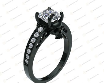 May include: Black skull ring with a large, clear cubic zirconia stone. The ring is made of black metal and has a detailed skull design.