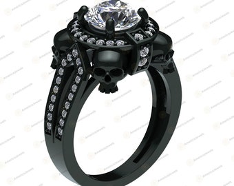 May include: A black skull ring with a large, clear, round gemstone surrounded by smaller gemstones. The ring is made of black metal and has a skull design on the band.