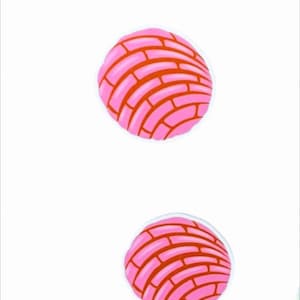 May include: Two pink concha bread illustrations with a red brick pattern on a white background. The conchas are round with a white outline. The image is a digital illustration.