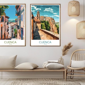 May include: Two framed prints of Cuenca, Spain. The prints feature colorful illustrations of the city's architecture and landscape. The top print shows a narrow street lined with buildings, while the bottom print shows a view of the city from a hilltop.