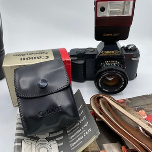 Canon T50 35mm camera bundle w/flash/manual excellent condition, 90 day warranty