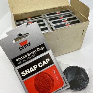 Pkg of 10 rare Prinz 48mm lens caps new in packaging!