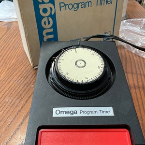 Omega program timer new in box for parts only