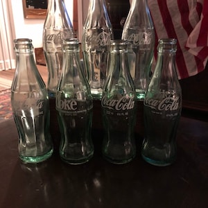 Set of 7 Vintage Coca Cola Bottles