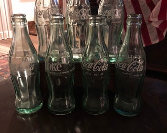 Lot de 7 bouteilles Vintage Coca Cola