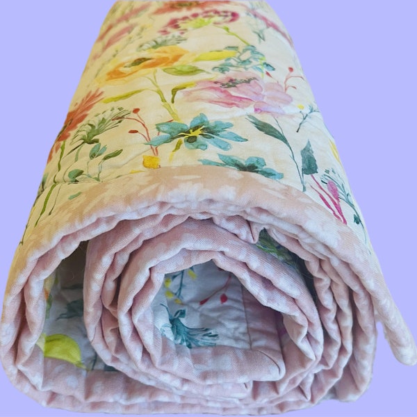 Handmade baby girl watercolor floral and pink whole cloth quilt. Reversible. 100% cotton fabrics and batting.