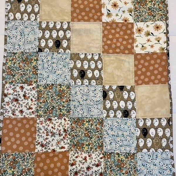 Handmade reversible all-cotton gender-neutral baby quilt with an adorable sheep fabric and other coordinating fabrics