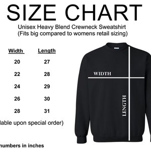 May include: Size chart for a Unisex Heavy Blend Crewneck Sweatshirt. The chart shows measurements in inches for sizes S to 2XL, with width and length dimensions. A black sweatshirt is shown with labeled width and length.