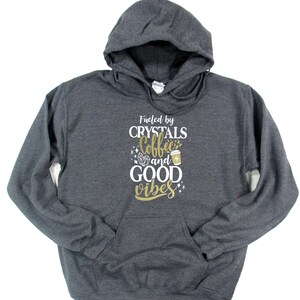 Crystal lover gift flat lay — women's cozy spiritual hoodie in black and gray, hand-pressed in Canada by Best Life Apparel