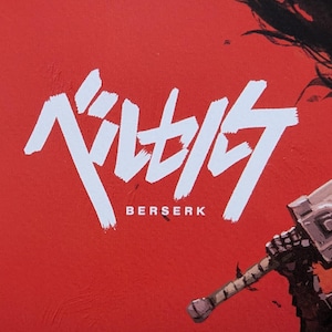 May include: A red background with the white text "ベルセルク" above the word "BERSERK". A portion of a weapon is visible in the lower right corner. The image has a textured appearance.