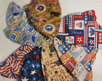 May include: A collection of patriotic-themed head coverings, featuring various designs with American flags, stars, and military emblems. The color palette includes red, white, blue, and tan. Some have text that reads "USA", "Patriotic", and "America".