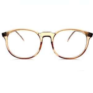May include: A pair of eyeglasses featuring a translucent, light brown, rounded frame. The glasses have a keyhole bridge design and thin, matching light brown temples that extend outward. The lenses are clear and oval-shaped, providing a simple look.