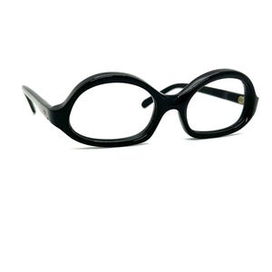 May include: Black oval-shaped eyeglasses with a thick frame.