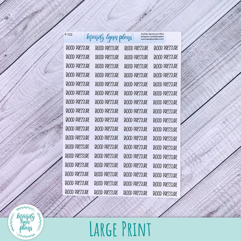 May include: A white rectangular sticker sheet featuring multiple rows of black text that reads BLOOD PRESSURE. The top of the sheet includes the text F-122, mandy lynn plans, and social media information. The stickers are arranged in a grid format.