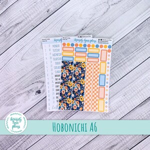 May include: Hobonichi A6 planner stickers. The stickers include a floral design, orange gingham, and various rectangular and circular shapes in blue, orange, and yellow. The text "HOBONICHI A6" is displayed at the bottom.