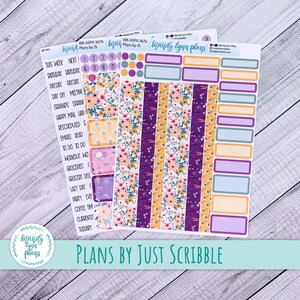 May include: Planner stickers with floral and geometric designs. The stickers feature floral stripes, rectangular boxes, and labels with text. The colour palette includes purple, yellow, pink, and white. The text "PLANS BY JUST SCRIBBLE" is visible on the stickers.