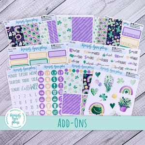 May include: A collection of planner stickers with a St. Patrick's Day theme. The stickers feature rainbows, shamrocks, pots of gold, and various functional icons in shades of green, purple, and gold. The text "ADD-ONS" is at the bottom.