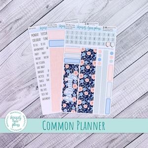 May include: A collection of planner stickers featuring a floral pattern in blue and peach, with the word "February" in cursive. The stickers include calendar dates, labels, and a logo that says "Mandy Lynn Plans". The text "Common Planner" is also visible.