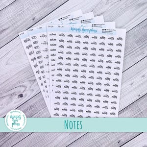 May include: Several sheets of white planner stickers with the word "notes" in a handwritten font. The stickers are arranged in a fan shape, with the text "Mandy Lynn Plans" visible. The word "NOTES" is printed in a larger font at the bottom.