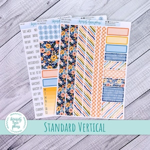 May include: A selection of planner stickers featuring floral, striped, and gingham designs. The stickers include labels, boxes, and decorative strips in blue, orange, and yellow. The text "STANDARD VERTICAL" is displayed at the bottom.