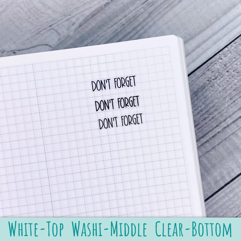 May include: A white grid-patterned notebook page featuring three lines of black text that read DON'T FORGET. The text is printed in a simple sans-serif font, centered on the page, and serves as a clear reminder for daily planning and organization.