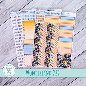 May include: Planner stickers featuring floral, plaid, and striped designs in blue, orange, and peach. The stickers include labels for tasks and appointments. The text "WONDERLAND 222" is at the bottom.