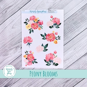 May include: A sheet of stickers featuring watercolour illustrations of pink and white peony flowers. The stickers are labelled "PEONY BLOOMS" and include the text "brandy lynn plans".