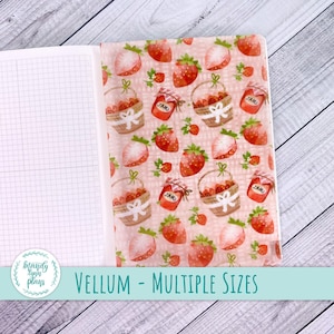 May include: A sheet of vellum paper with a pink and white gingham pattern. The pattern features strawberries, jars of jam, and baskets of strawberries. The text "VELLUM - MULTIPLE SIZES" is printed at the bottom of the sheet.