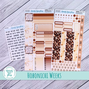 May include: A set of coffee-themed planner stickers with a brown and beige color scheme. The stickers feature coffee beans, coffee cups, and text that says "Mandy Lynn Plays" and "Hobonichi Weeks".