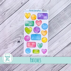 May include: A sheet of colourful planner stickers featuring various shapes, including hearts, circles, and rectangles, with watercolour-style shading and stitched edges. The word "PATCHES" is printed at the bottom. The brand name "Mandy Lynn Plans" is visible.